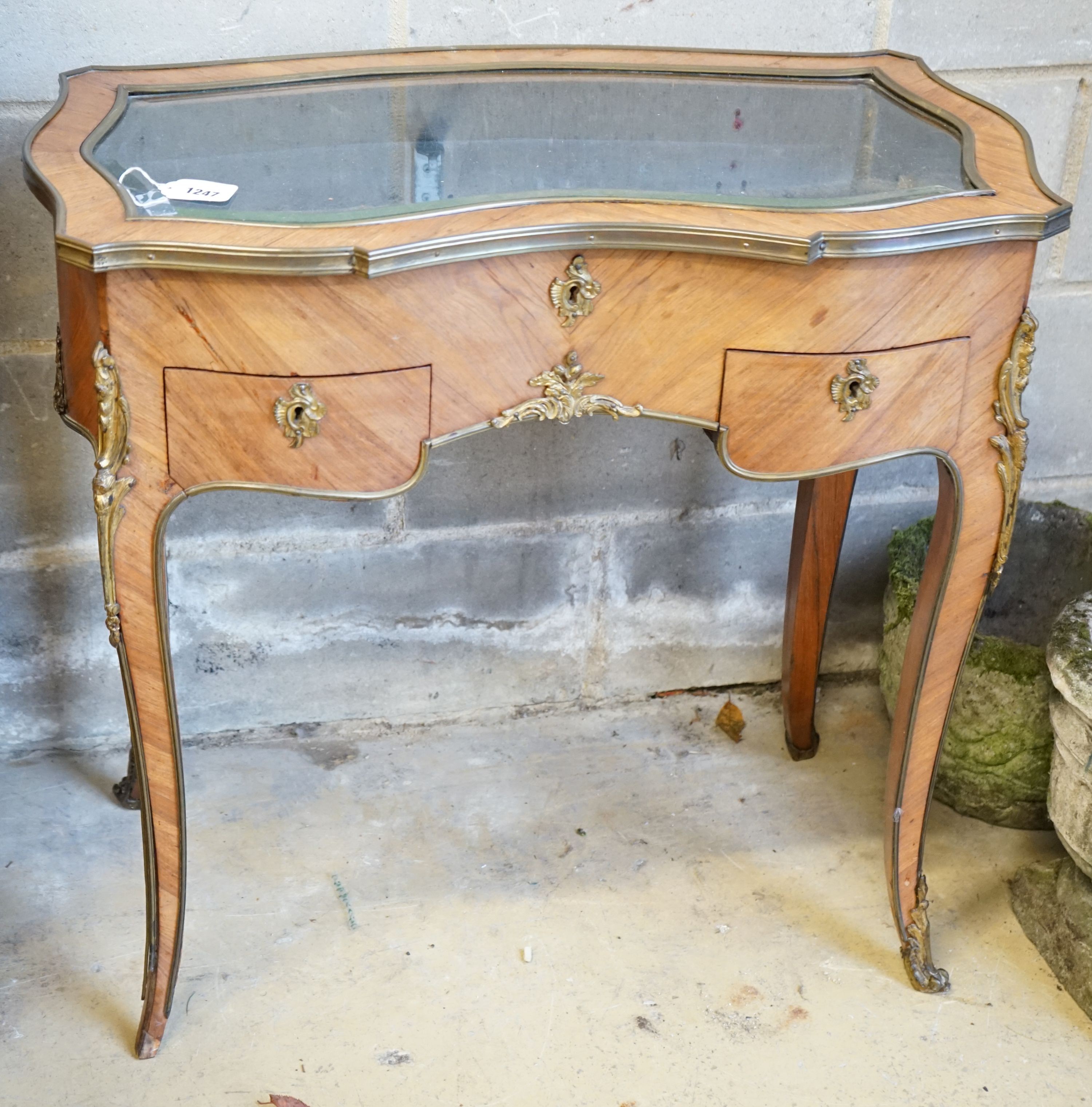 A reproduction kidney shaped French kingwood vitrine, width 79cm, depth 45cm, height 76cm